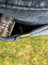 Titanium pocket clip with magnets and hub screw.